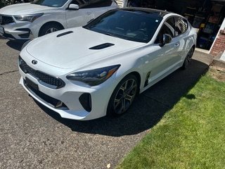 White sedan angled exterior view